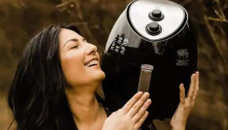 womans romantic photoshoot with air fryer