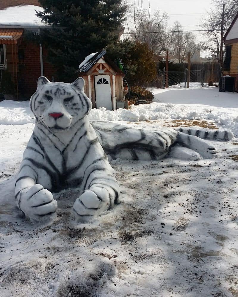 Morn Mosley and family created snake snow sculpture