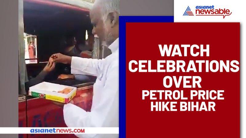 Man distributing sweet as Petrol crossed 100 rupee mark: Watch viral video - gps