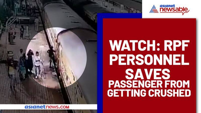 RPF Cop saves man from getting crushed under running train, Viral video - gps