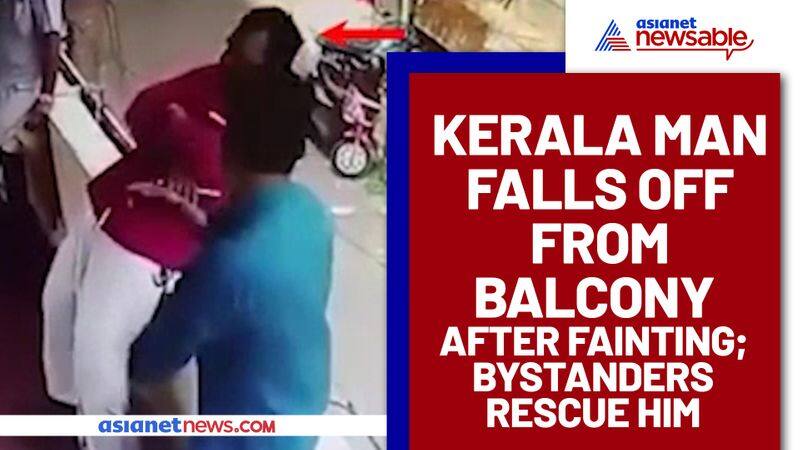 Man falls off from Balcony after fainting; bystanders dramatically rescue him, Watch video - gps