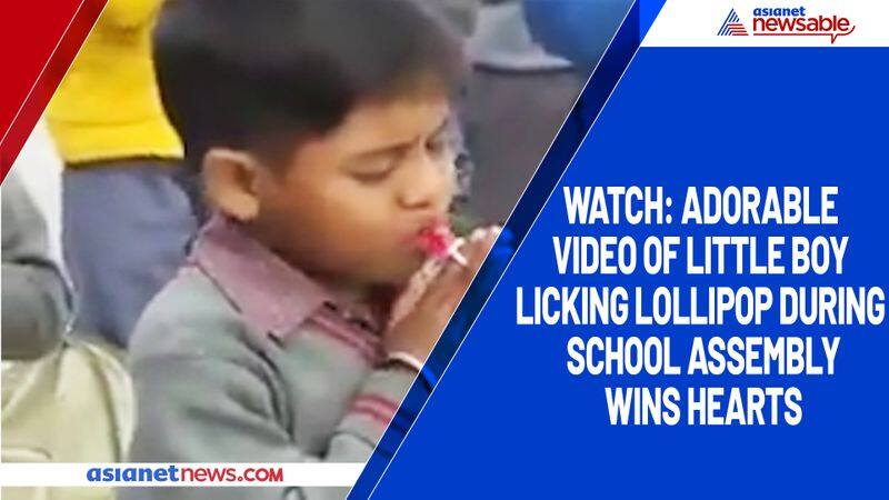 Watch Adorable video of little boy licking lollipop during school assembly wins hearts-tgy