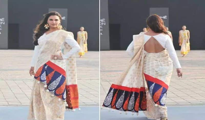 Coral silk again in fashion, this style of Lara Dutta in the backless blouse is on fire