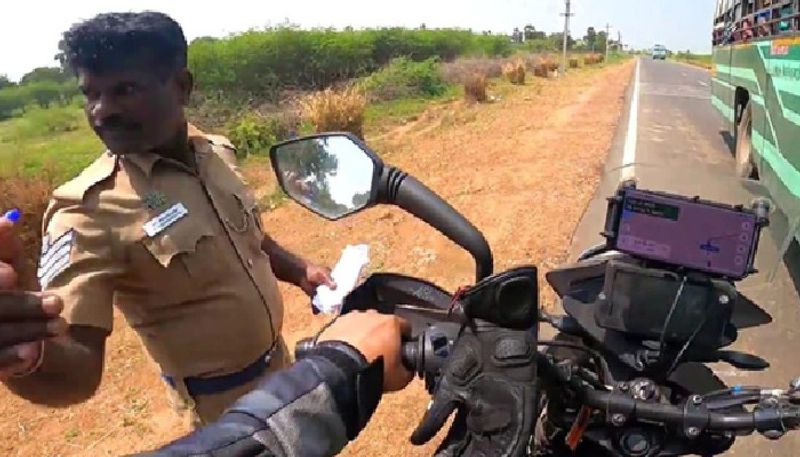 video in which police officer asks help from bike rider