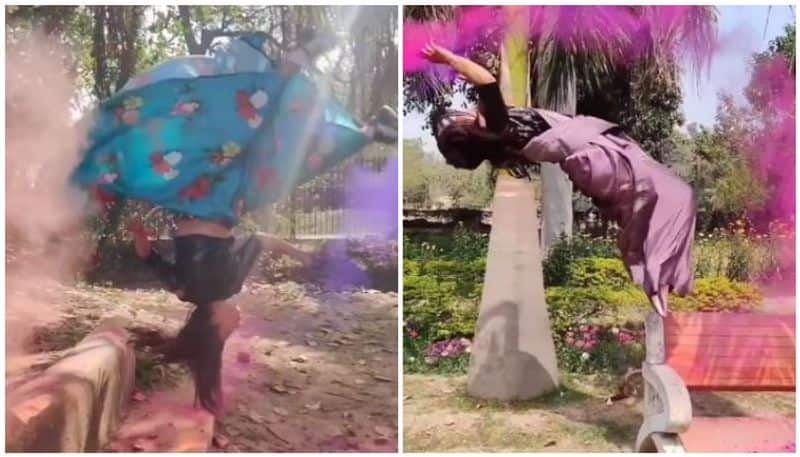 gymnast named Parul Arora holi with a colourful routin