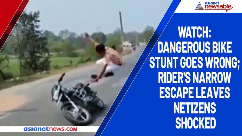 Watch Dangerous bike stunt goes wrong; rider's narrow escape leaves netizens shocked-tgy