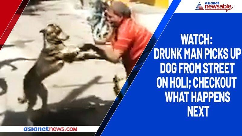 Watch Drunk man picks up dog from street on Holi; checkout what happens next-tgy