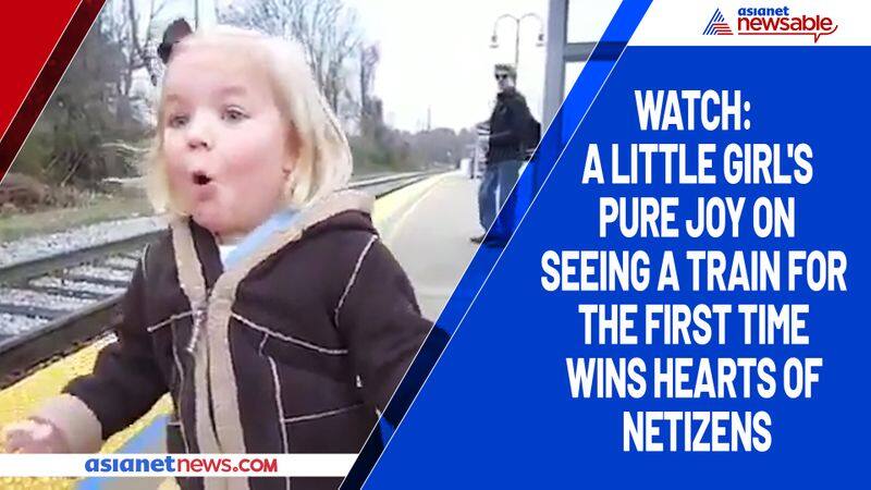 Watch A little girl's pure joy on seeing a train for the first time wins hearts of netizens-tgy