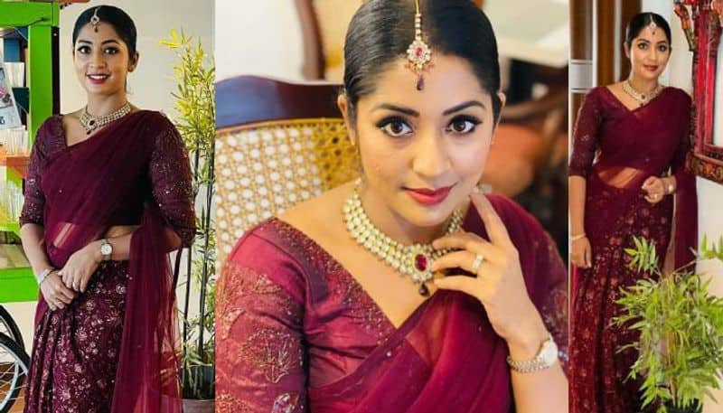 Navya nair in wine colour outfit