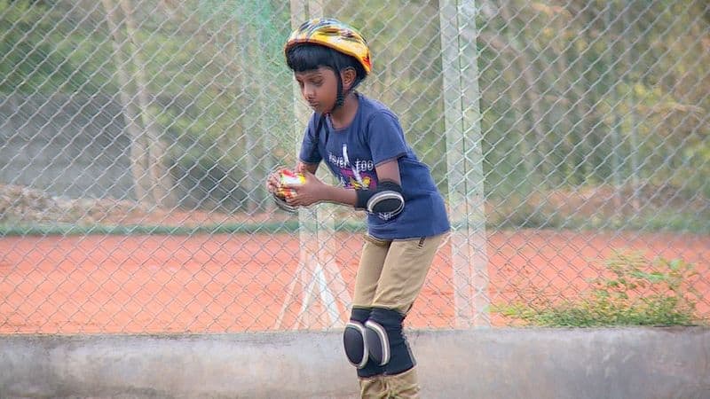 10 year old boy Sarang with rubiks cube and roller skating