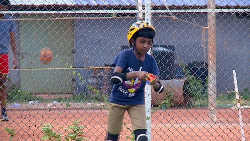 10 year old boy Sarang with rubiks cube and roller skating