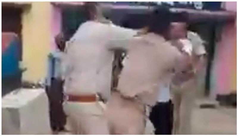 cops thrash man for not wear mask inside the temple