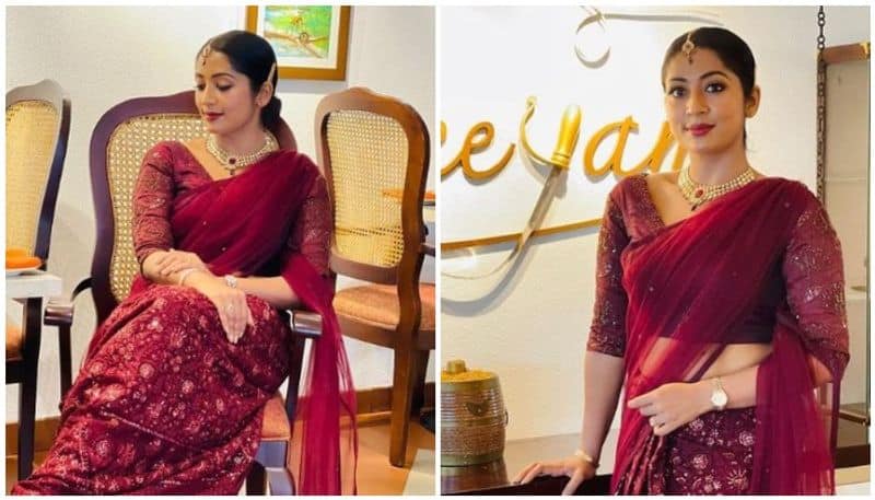 viral photos of navya Nair wine colored sari