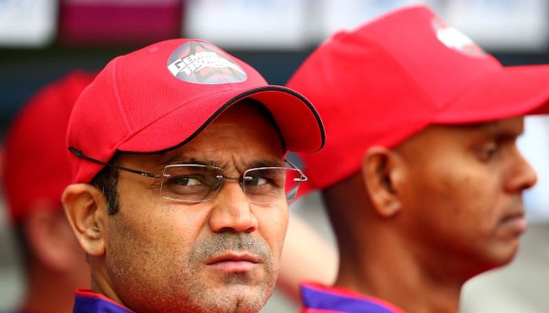 IPL 2021 KKR vs MI Virender Sehwag has slammed Dinesh Karthik and Andre Russell