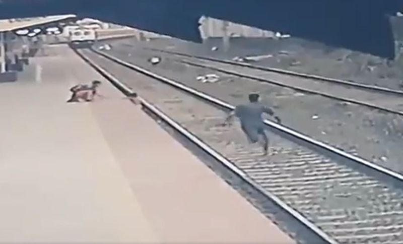 Railwayman saves life of child who fell on railway tracks mumbai video viral ckm