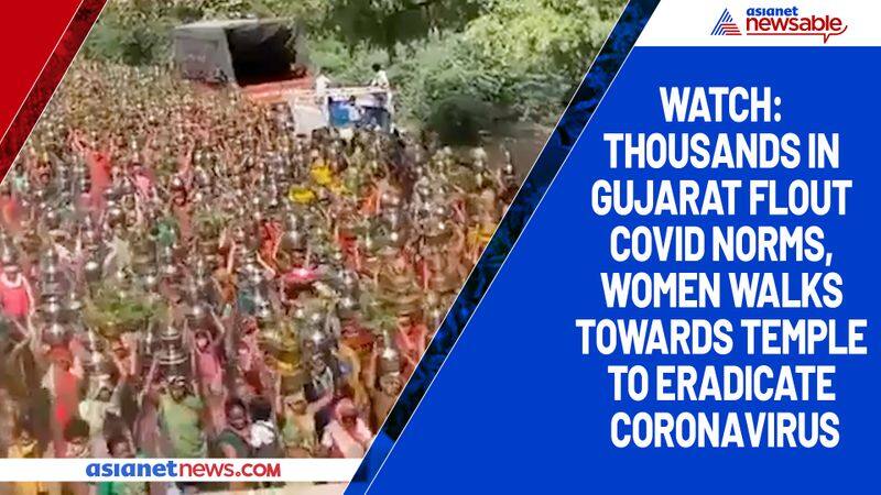 Watch Thousands in Gujarat flout COVID norms, women walks towards temple to eradicate coronavirus-tgy