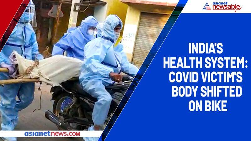 Indias health system COVID victim's body shifted on bike-ycb