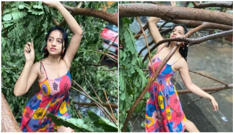 TV actress Deepika Singh poses beside tree uprooted by Cyclone Tauktae