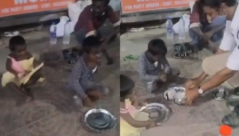 traffic police constable gives his meals to children who lives in street