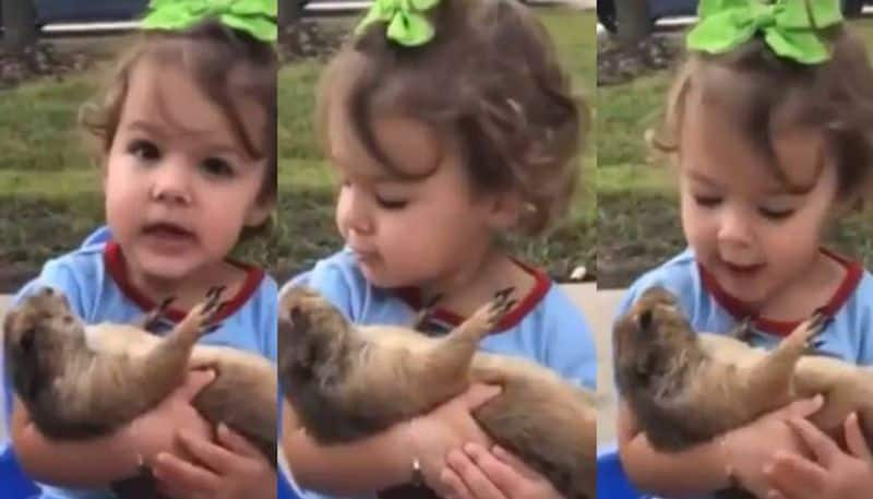 Viral Video of Little Girl Singing to Dog