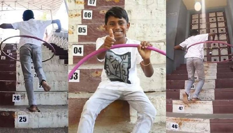 boy breaks Guinness World Record for being fastest to climb steps while hula hooping