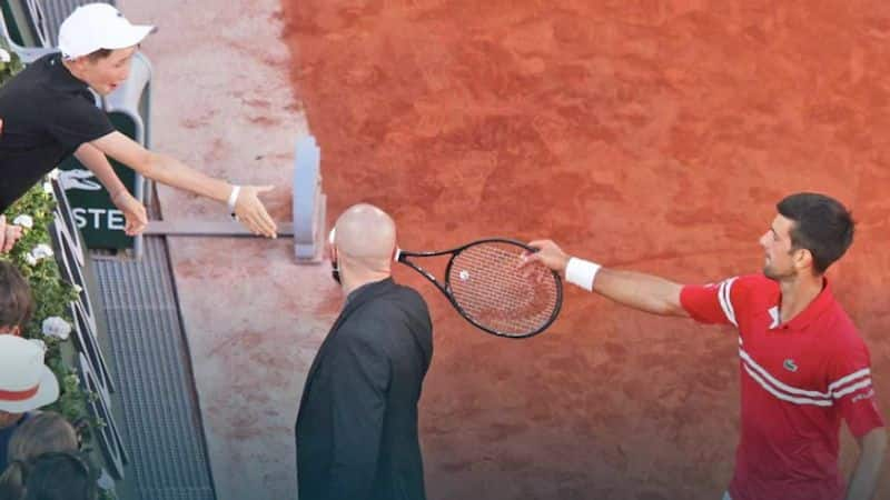 Novak Djokovic gifted his racquet to a young fan after winning his French Open title