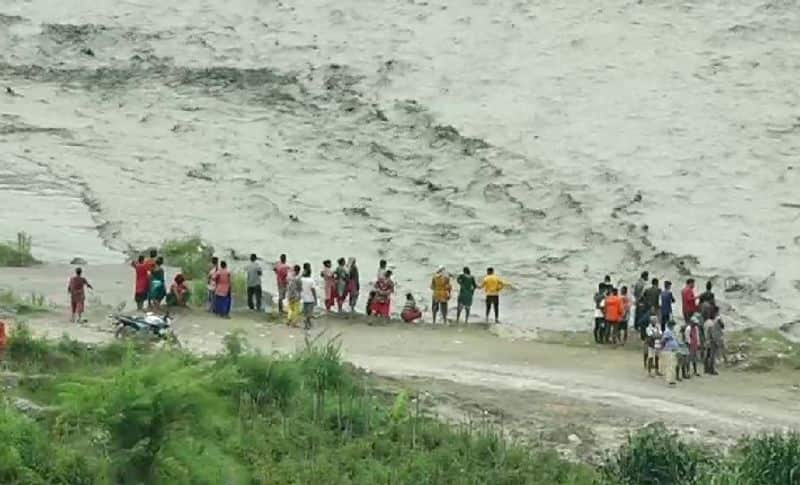 Locals Rescue 25 Students From Bus Stranded in Flood Water In Mhabubnagar