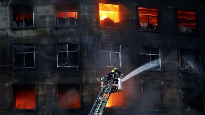 52 dead in Bangladesh factory fire as workers locked inside pod