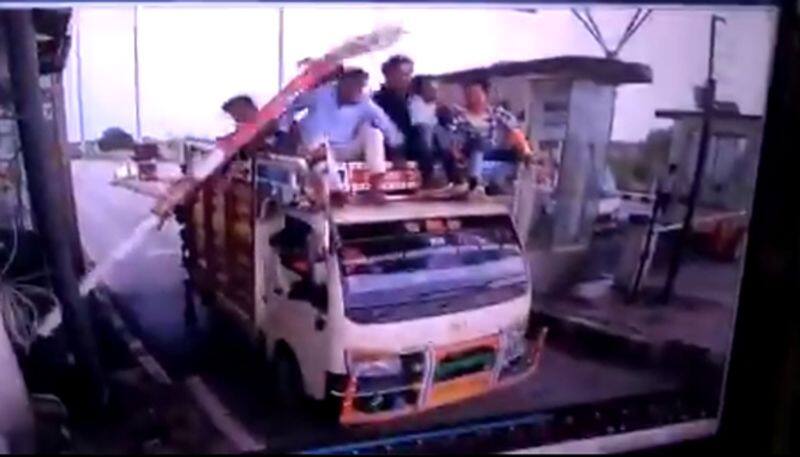 Watch truck filled with people gets hit by a barrier at the toll plaza - gps