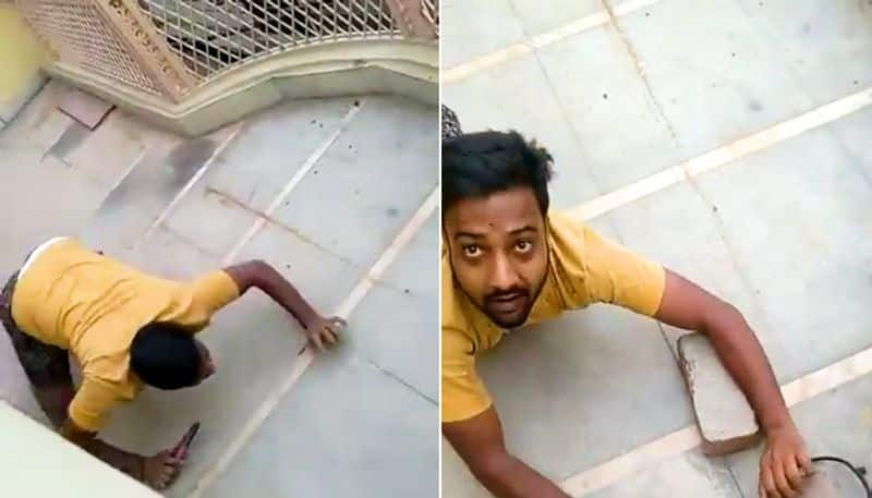 Man sneaks into balcony to snip illegal wire ends up with hilarious twist; watch video-tgy