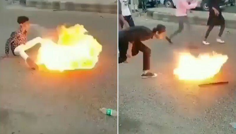 Young boys playing with fire in middle of the road shocks internet; Watch the video-tgy