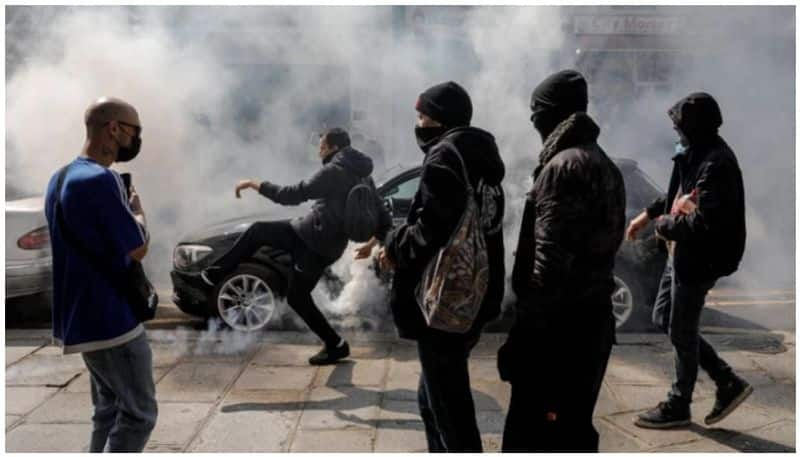 French police fire tear gas as anti-vaccine protest turns violent