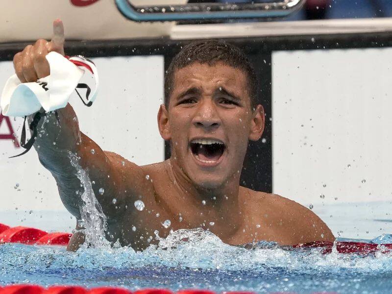 last in heats finished with gold medal  Ahmed Hafnaoui of tunisia stuns olympics swimming viewers