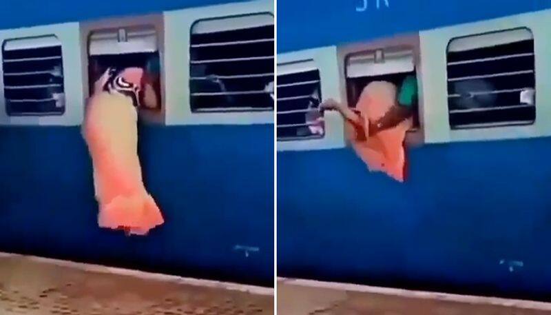 Woman in saree enters train through emergency exit window; leaves netizens in splits-tgy