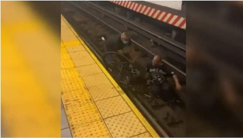 Wheelchair bound man falls on train tracks VIRAL VIDEO