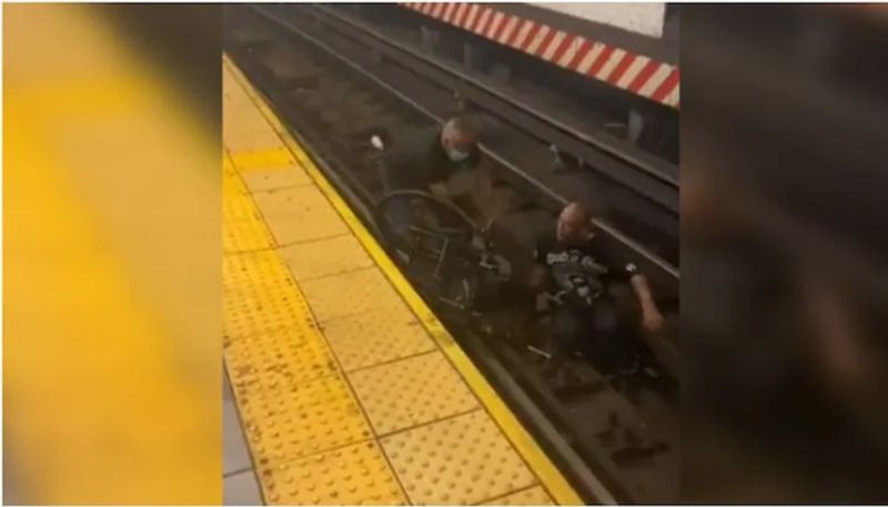 Wheelchair bound man falls on train tracks VIRAL VIDEO