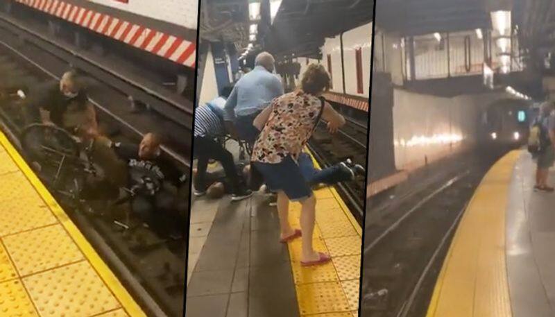 Bystanders rescue man on a wheelchair from approaching train; watch video - gps