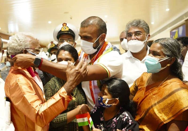 PR Sreejesh presents Olympic medal to his father PR Raveendran