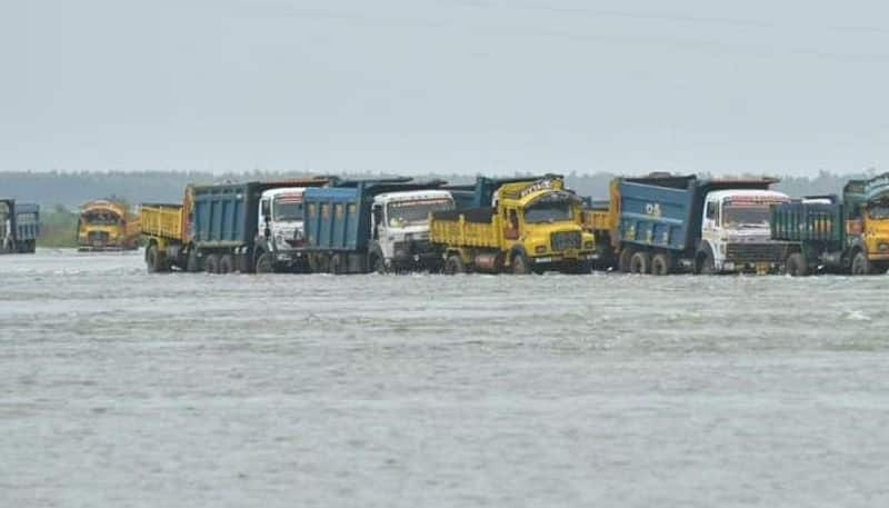 132 trucks pulled out from krishna water with crane in krishna district