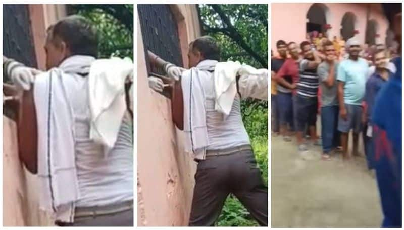 people wait in queue outside building man gets vaccinated through the window