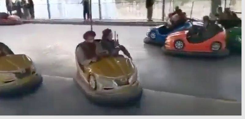 Taliban fighters seen enjoying amusement park rides gcw