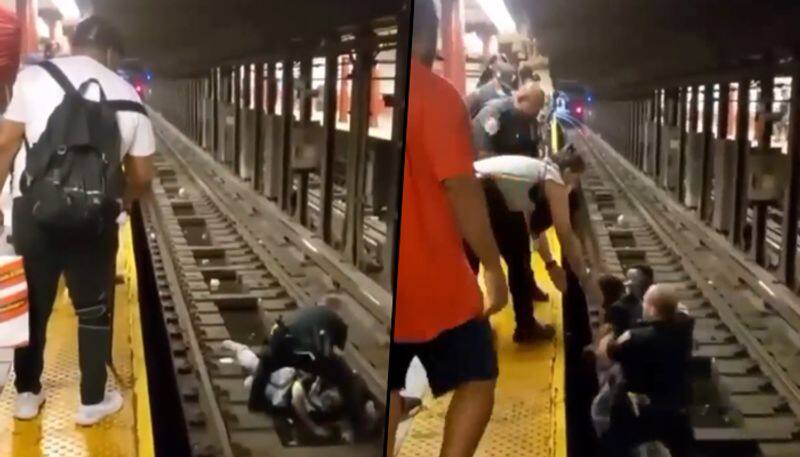 Passengers collapse on subway tracks gets saved by NYPD Officers; watch video - gps