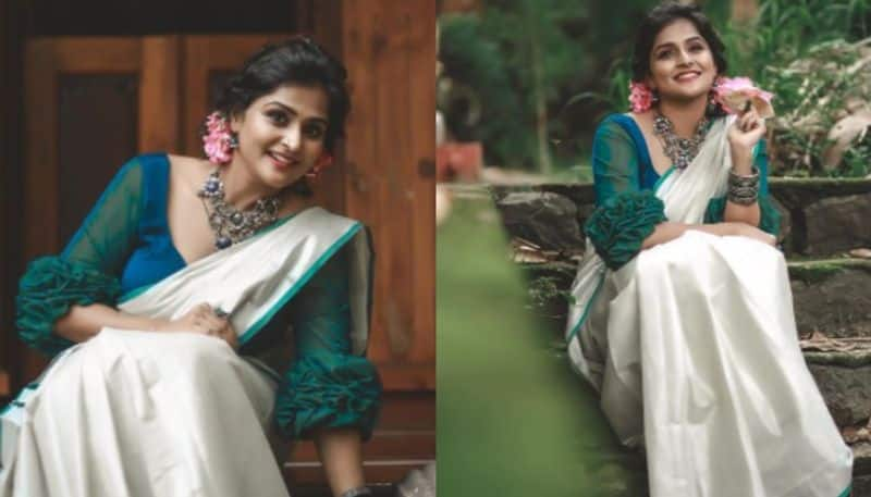 ramya nambessan s uthradam dina special photoshoot in saree