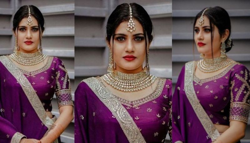 alina padikkal in purple lehenga for mehandi function