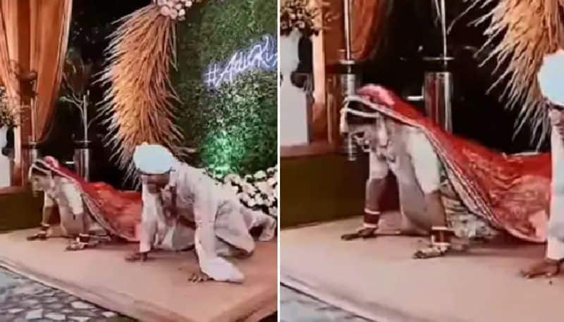 bride and groom do push ups onstage