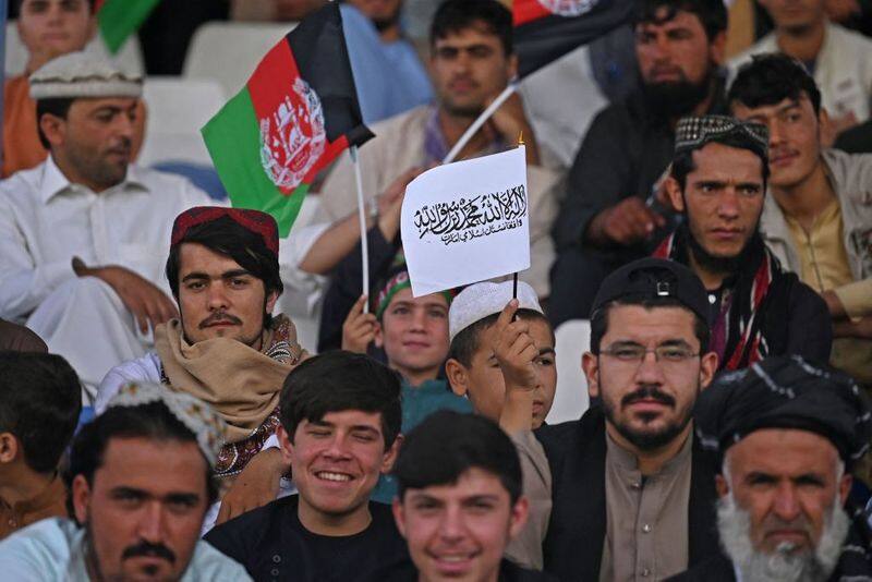 Taliban Afghanistan flags wave together at cricket match gcw