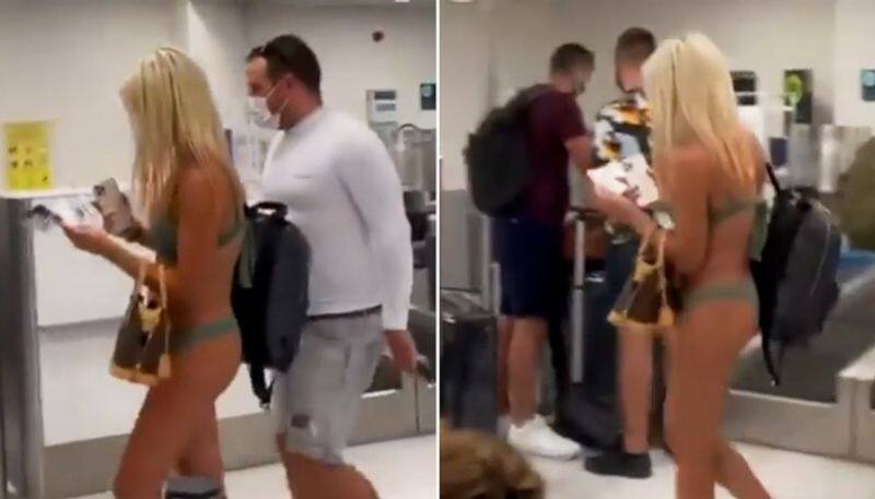 US woman walks through the airport in bikini and face mask; video goes viral-tgy