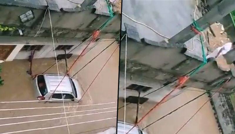 Man ties car with ropes to prevent from being washed away; watch video - gps