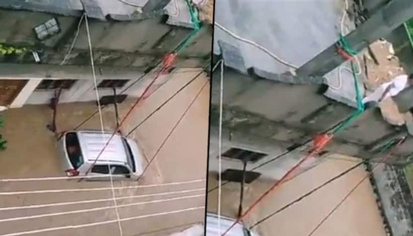 Man ties car with ropes to prevent from being washed away; watch video