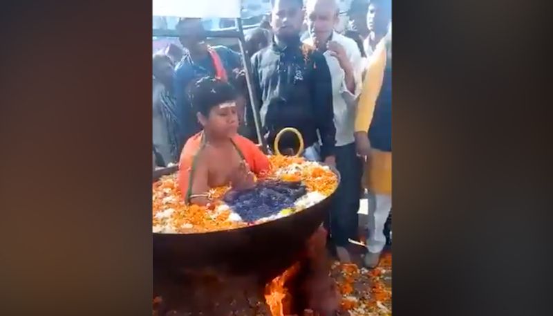 Boy sitting in vessel full of boiling water goes viral; internet claims it fake-tgy